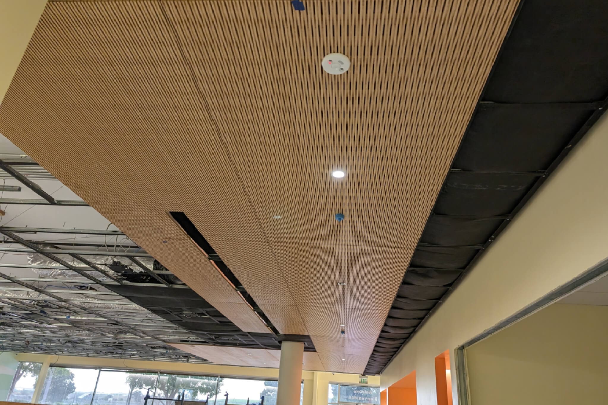 Wooden slat ceiling in construction site.